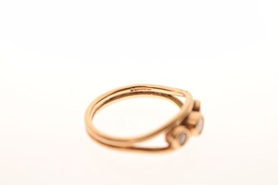 Lot 17 - Modern 9ct gold three-stone diamond ring