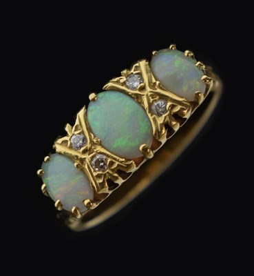 Lot 24 - Opal and diamond 18ct gold ring