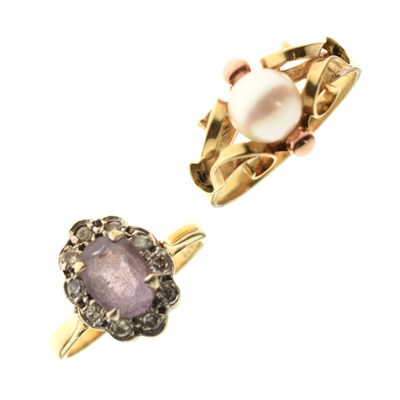 Lot 42 - Amethyst and diamond cluster ring and a cultured pearl yellow metal dress ring