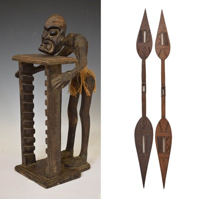 Lot 359 - Carved wooden tribal CD holder with figural element and two spears