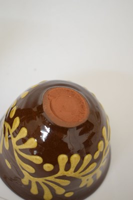 Lot 538 - Studio Pottery - Set of eight slip decorated terracotta goblets by Wetheriggs Pottery