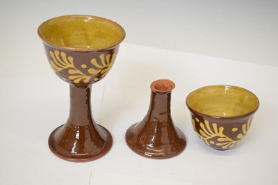 Lot 538 - Studio Pottery - Set of eight slip decorated terracotta goblets by Wetheriggs Pottery