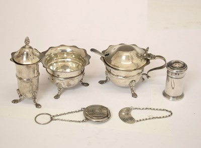 Lot 222 - Late Victorian silver three-piece condiment, a George V silver whisky label, etc