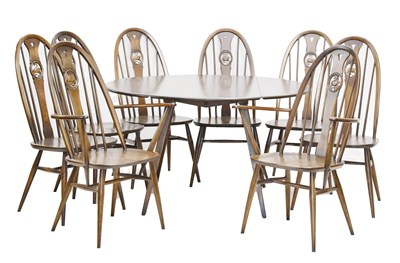 Lot 686 - Ercol - Set of eight Windsor swan-back dining chairs and table