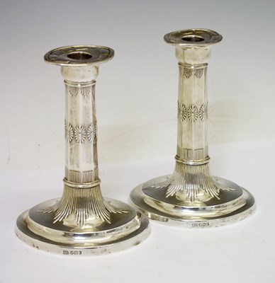 Lot Pair of Edward VII silver candlesticks of oval form