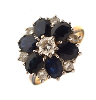 Lot 30 - Sapphire and diamond 18ct gold flower cluster ring