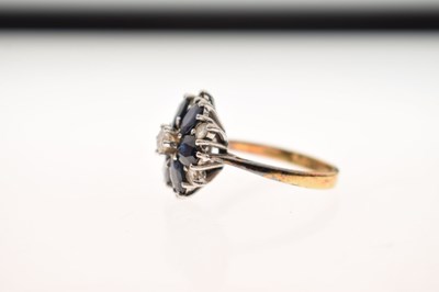 Lot 30 - Sapphire and diamond 18ct gold flower cluster ring