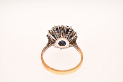 Lot 30 - Sapphire and diamond 18ct gold flower cluster ring