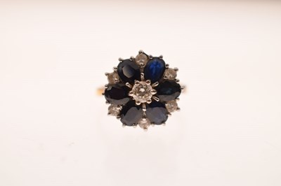 Lot 30 - Sapphire and diamond 18ct gold flower cluster ring