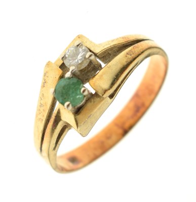 Lot 32 - Emerald and diamond two-stone ring