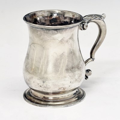 Lot George II silver mug of baluster form with acanthus-topped scroll handle