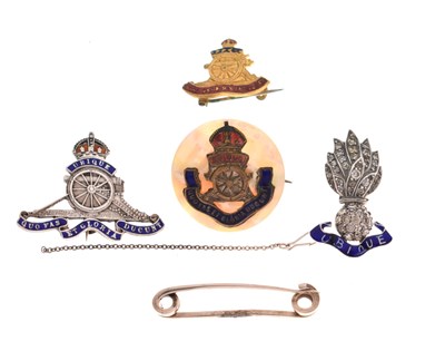 Lot 414 - Four Royal Artillery badges