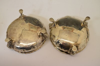 Lot 112 - Matched set of four silver salts each standing on three mask and paw feet