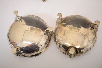 Lot 112 - Matched set of four silver salts each standing on three mask and paw feet