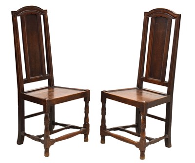 Lot 647 - Pair of early 18th century oak hall chairs