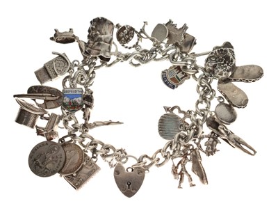 Lot 111 - Silver charm bracelet