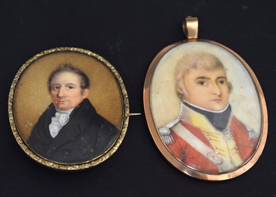 Lot 652 - Two 19th century oval portrait miniatures on ivory