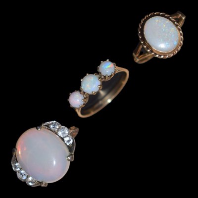 Lot 53 - Three opal dress rings