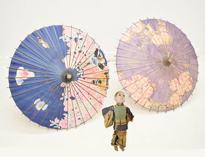 Lot 469 - Japanese composition head doll and two parasols