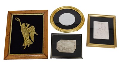 Lot 337 - Three framed plaster reliefs and a framed brass angel