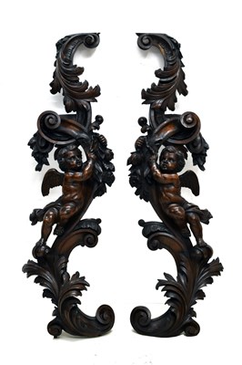 Lot 449 - Pair of mid 19th century carved walnut figural wall appliqués