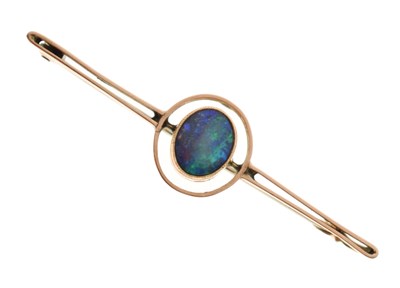 Lot 81 - Black opal doublet 9ct rose gold bar brooch