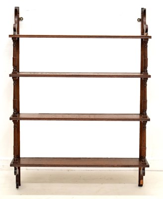 Lot 734 - Late 19th century mahogany four-tier wall mounted open bookshelf