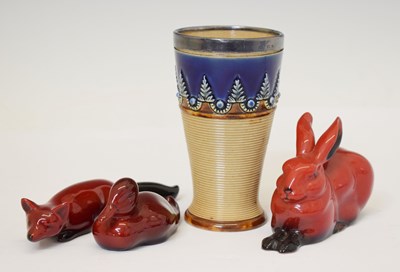 Lot 509 - Three Royal Doulton flambé animals and Doulton Lambeth beaker