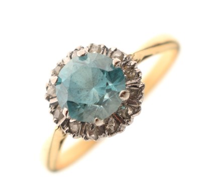 Lot 37 - Blue topaz-coloured stone and diamond cluster 18ct gold ring