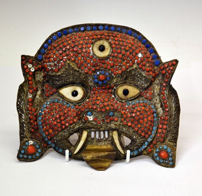 Lot 264 - South East Asian sheet brass mask of Mahakala, circa 1900