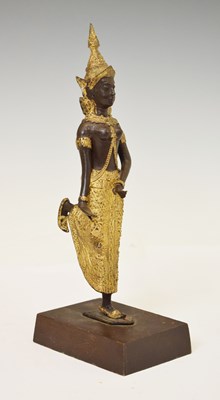 Lot 543 - Thai patinated and gilt metal figure of a Teppanom temple dancer