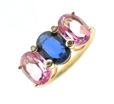 Lot 67 - Three-stone sapphire and diamond 9ct gold dress ring