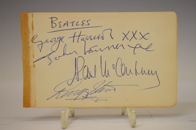 Lot 197 - A set of Beatles autographs on a single page with autograph album