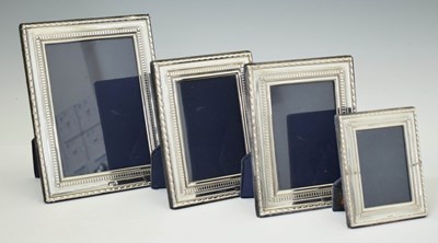 Lot 276 - Graduated set of four Elizabeth II silver mounted easel photograph frames