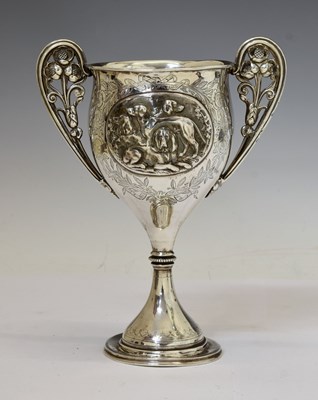 Lot 115 - Victorian silver trophy cup with twin-scroll handles and medallion decorated with gun dogs