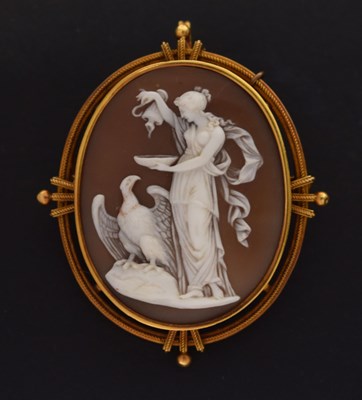 Lot 122 - Yellow metal shell cameo brooch depicting Hebe and Zeus (as an eagle)