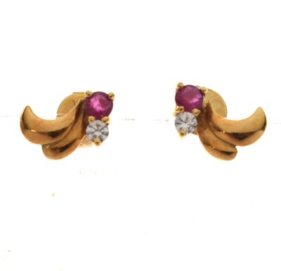 Lot 181 - Pair of diamond and ruby ear yellow metal studs