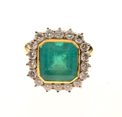 Lot 9 - Emerald and diamond 18ct yellow and white gold set cluster ring