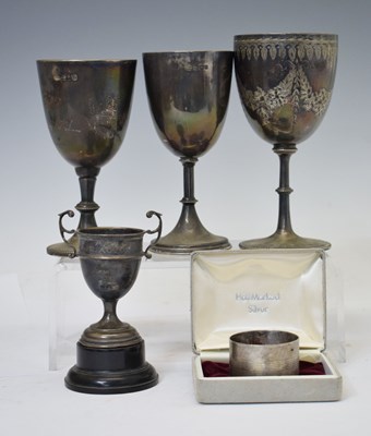 Lot 273 - Mid-Victorian silver trophy cup and three later examples