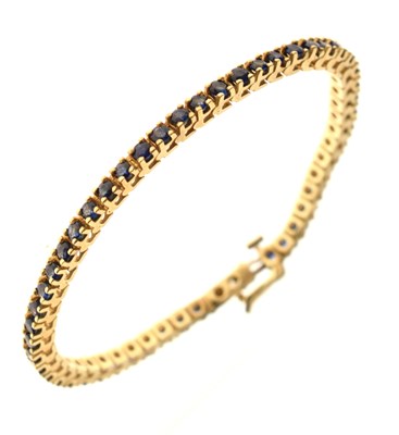 Lot 165 - Sapphire 9ct gold line bracelet