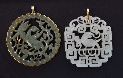 Lot 540 - Two Chinese jade bi disc pendants