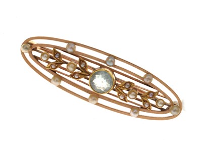 Lot 111 - Edwardian seed pearl and aquamarine-coloured stone brooch