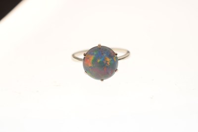 Lot 49 - Black opal doublet platinum ring