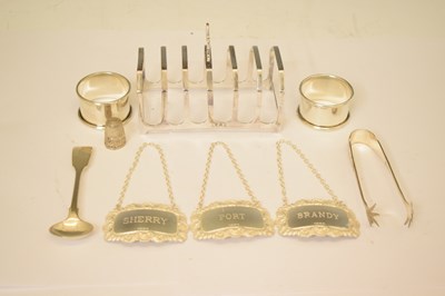 Lot 161 - George V silver toast rack, a set of three Elizabeth II silver decanter labels, etc