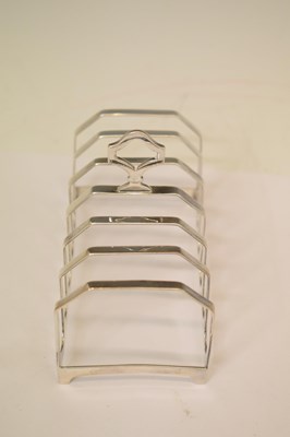 Lot 161 - George V silver toast rack, a set of three Elizabeth II silver decanter labels, etc