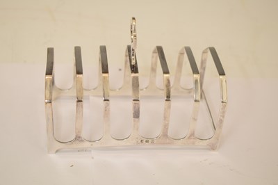 Lot 161 - George V silver toast rack, a set of three Elizabeth II silver decanter labels, etc