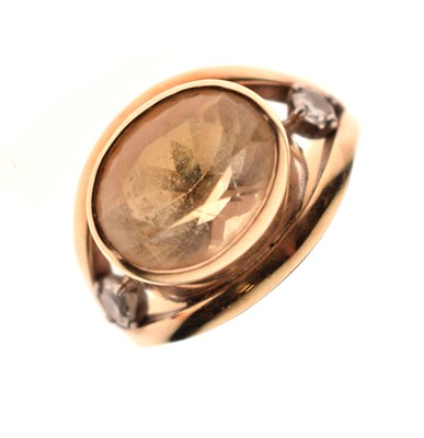 Lot 10 - Yellow stone and diamond unmarked yellow metal ring