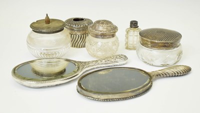 Lot 159 - Two silver-backed dressing mirrors, together with five silver topped dressing table jars