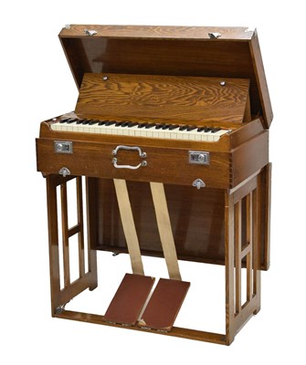 Lot 328 - Mid 20th century oak cased 'Pearl River' pedal-operated travelling harmonium