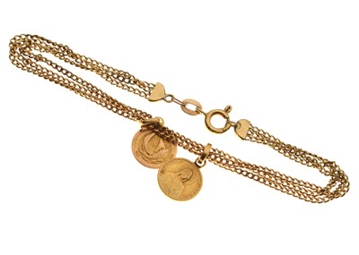 Lot 60 - Multi-strand yellow metal bracelet stamped '14K', attached two medallions each stamped '750'